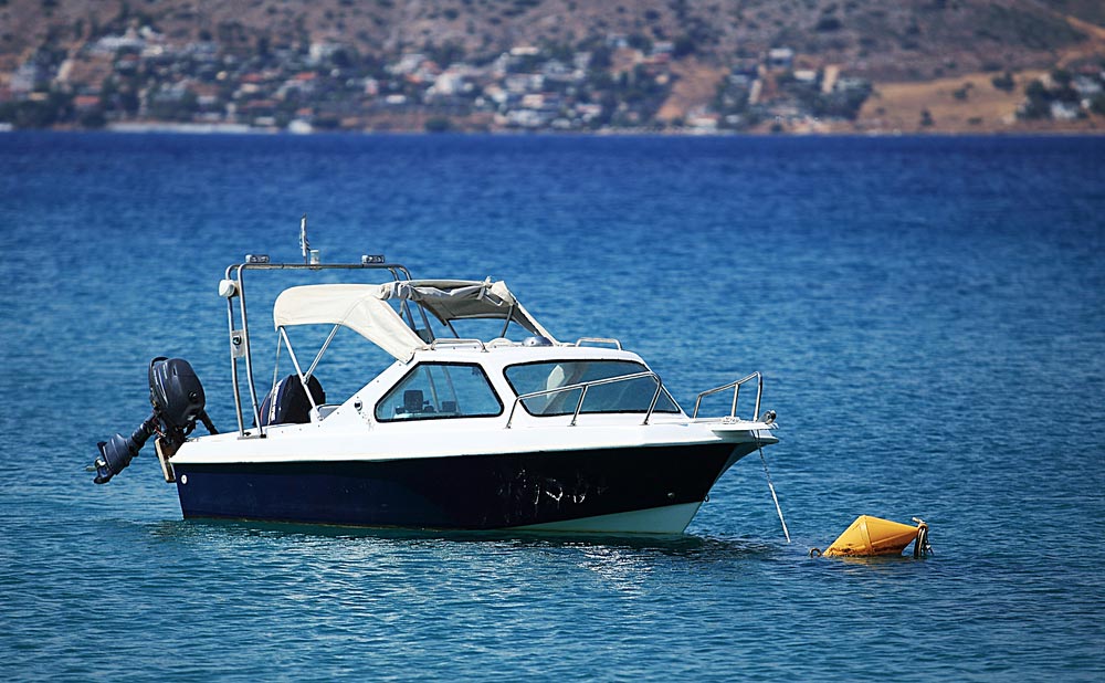 Motor Boat Anchored On Sea